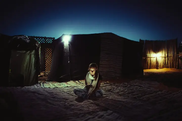 Traditional tent at a standard camp at night