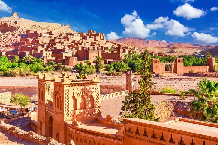 Kasbah of Ait Benhaddou surrounded by palm trees, southern Morocco